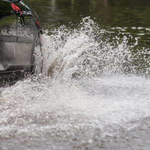 car in water after heavy rain and flood
