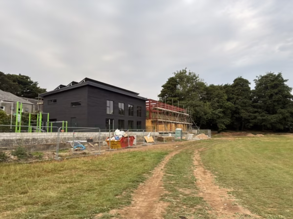 View of Chacewater Recreation Centre under construction, and part of the Outdoor Fitness station to the left of the building.